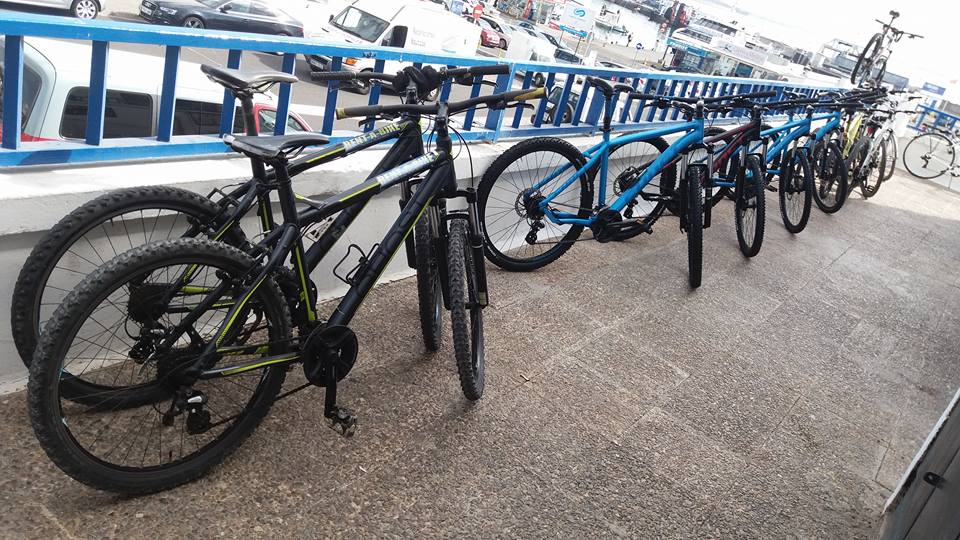 MTBs lined up outside the shop